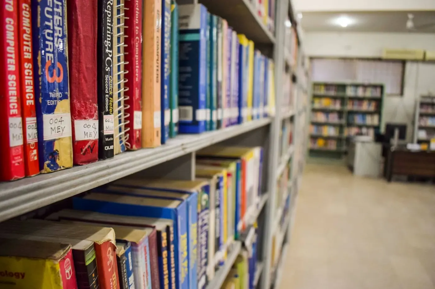 Reading area with study tables in the Iqra National University Information Resource Centre
